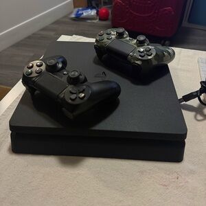 PS4 Slim Console with Black and Camouflage Controllers